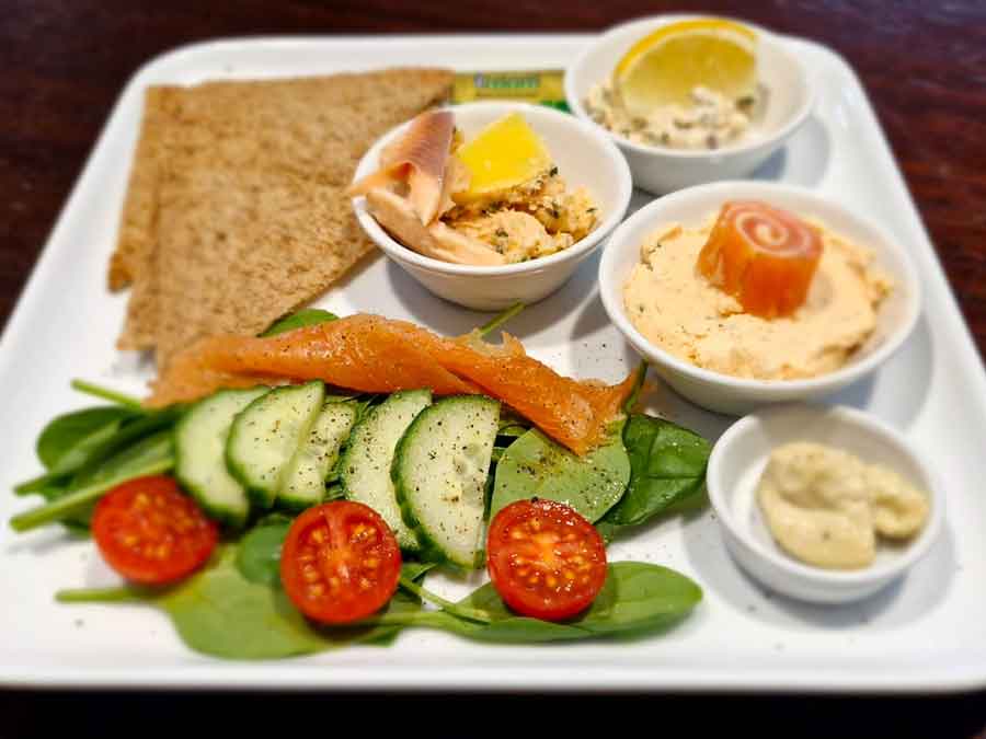 A trio of Mere fish farm smoked trout terrine served with wasabi mayonnaise & melta toast
